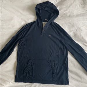 Navy Sweatshirt with buttons and hood. Barely worn